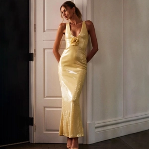 Elegant bright yellow sequined evening gown with deep V-neck and 3D floral detail