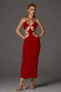 Close-up of red bodycon dress featuring elegant waist cut-outs and golden metal rings