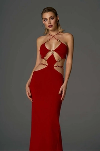 Detail of red cut-out dress featuring metal ring buckles and bandage strap design