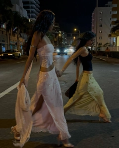 Detailed view of glamorous sequined maxi skirts with high side slits for summer parties
