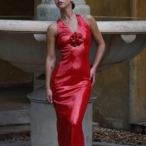 Sparkling red sequin halter dress with 3D floral accent and elegant side slit for evening wear