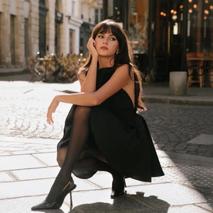 Elegant backless black dress with bow tie neck and slim fit for cocktail parties