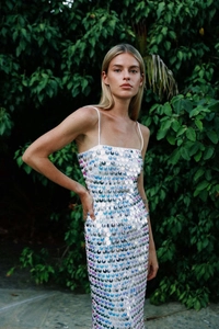 Detail of white sequin dress with iridescent rainbow shimmer and thin spaghetti straps