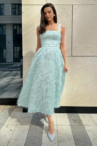 Detail of light blue sleeveless dress with textured feather fabric and square neckline