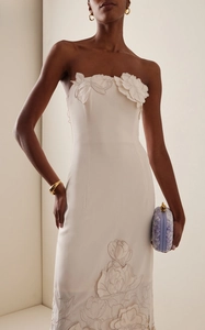 Detail of 3D floral appliques and elegant embroidery on a slim backless evening gown