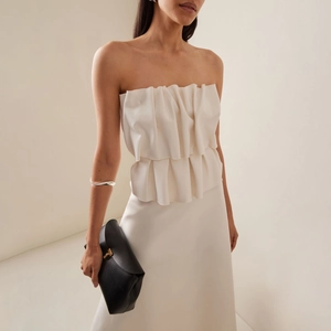 Elegant white strapless dress with double-layered pleated ruffles and a minimalist satin finish