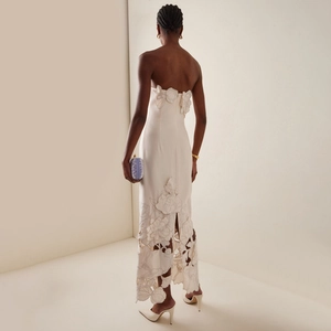 Off-white strapless slim dress with laser-cut floral embroidery and an open-back design