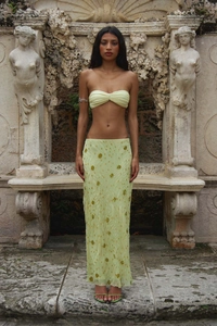 Detail of sequin floral embroidery on a yellow mesh vacation skirt set