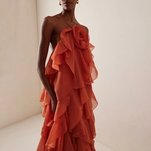 Coral orange halter dress with 3D floral accent and layered ruffles for vacation