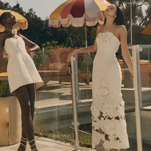 Elegant white strapless gown and mini dress with 3D floral appliqués and cut-out details