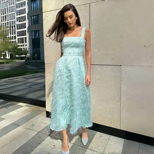 Elegant light blue midi dress featuring sleeveless square neck and full feather fringe detail