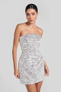 Detailed view of shimmering silver sequins on a strapless bodycon mini party dress