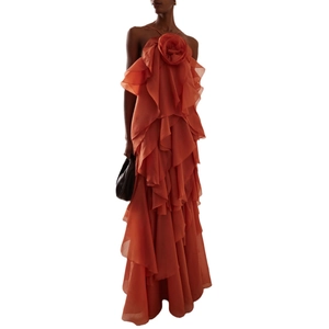 Halter neck maxi dress with 3D floral accent and tiered ruffles in burnt orange