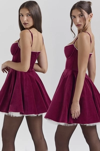 Detail of burgundy velvet dress featuring elegant mesh lace hem and slim fit bodice