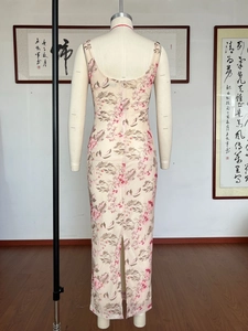 Detail view of the floral mesh sundress featuring back slit and invisible zipper