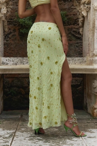 Detailed lime green sequin embroidery and side slit on an elegant maxi dress