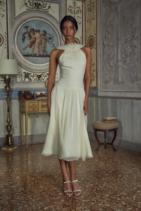 Elegant white halter neck midi dress with a satin top and layered pleated chiffon skirt