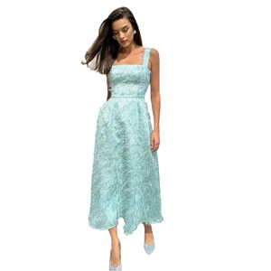 Elegant light blue backless maxi dress with feather fringe and wide straps