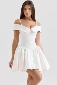 Close-up of white off-the-shoulder mini dress with fold-over collar and pleats