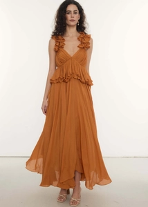 Detail of the V-neck ruffles and pleated chiffon fabric on a deep caramel bohemian dress