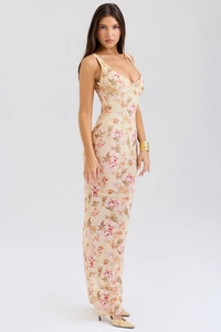 Detail of floral print corset dress with slim fit mermaid hem in apricot and pink hues