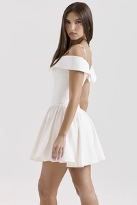 Elegant white off-shoulder mini dress with pleated skirt and thin straps for parties