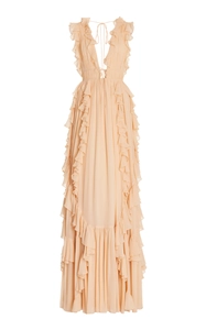Detail of elegant V-neck apricot maxi dress with tiered ruffles and lace-up back design