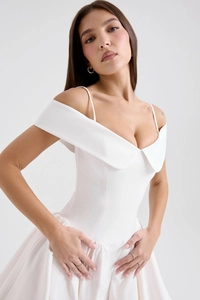 Detail of white off-shoulder mini dress featuring elegant folded collar and satin texture