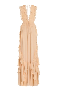 Detail of peach pink pleated chiffon maxi dress with deep V-neck and ruffle layers