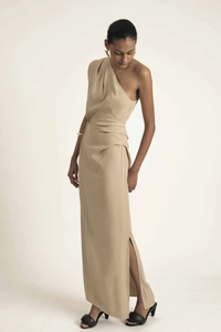 Detail of elegant one-shoulder dress with side slit and waist ruching in champagne fabric