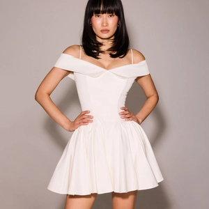 Chic white off-the-shoulder pleated mini dress with slim waist and tiered skirt