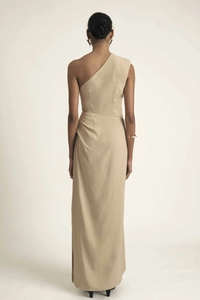 Detail of elegant one-shoulder ruched waist long dress in beige with premium drape fabric