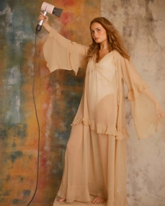 Detail view of boho apricot sheer maxi dress with deep V-neck and ruffled layered sleeves