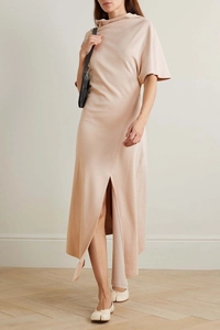 Detail of light pink French dress with high neck design and side slit hemline