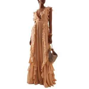 Deep V-neck backless pleated maxi dress with ruffled layers in light apricot silk
