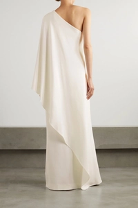 Back view of elegant ivory satin one-shoulder gown with cape-style draping and sleek train