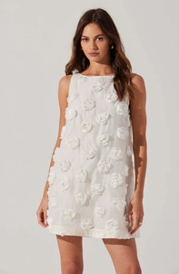 Close-up of intricate 3D rose flower appliques on a white sleeveless party dress
