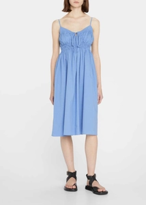 Detail of light blue midi dress showing pleated bust design and adjustable drawstring waist