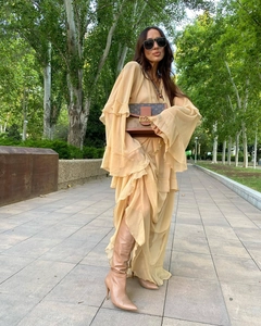 Detail of multi-layered ruffle sleeves and flowing chiffon hemline on a peach maxi dress