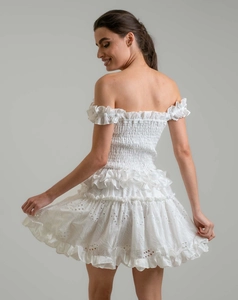 Detailed view of white off-the-shoulder dress with eyelet embroidery and smocked waist