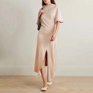 French casual sleeveless dress in nude pink with waist pleats and asymmetric slit hem