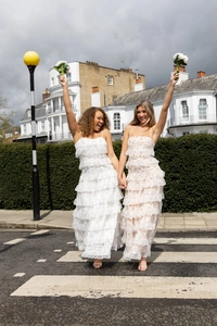 Detail of layered lace maxi dresses with embroidery and ruffles for casual vacation wear