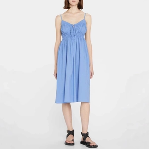 Sky blue midi dress with spaghetti straps, smocked chest and delicate drawstring bow