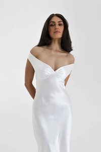 Detail of elegant white satin off-shoulder evening dress with pleated V-neckline