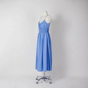 Elegant light blue backless midi dress with delicate spaghetti straps and ruffle details