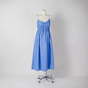 Light blue backless camisole midi dress with ruffles and drawstring detail on mannequin