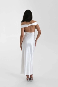 Elegant white satin evening dress showing the backless detail and refined off-shoulder cut