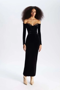 Detail of elegant black velvet off-shoulder evening dress with fine lace neckline trim