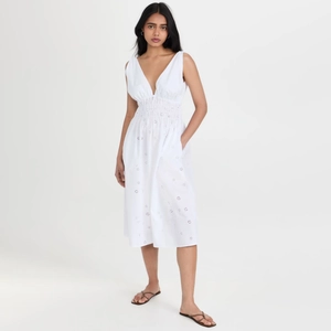 Elegant white V-neck sleeveless midi dress with delicate hollow embroidery and cinched waist