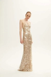 Close-up of champagne sequin evening dress showing detailed white circular sequins and mesh